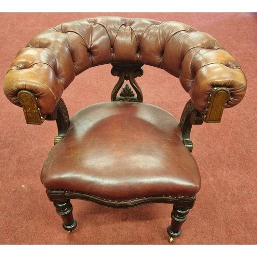 1448 - An Early 19th Century Mahogany Library Chair with deep buttoned Leather upholstry.