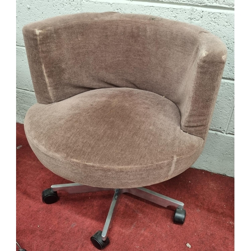 1461 - A Low Swivel Chair with Brown fabric seat .