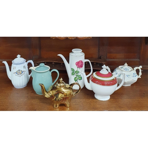 1512 - A Group of Assorted Teapots .