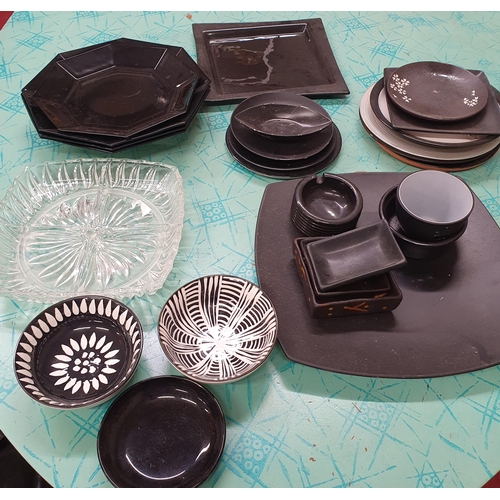 1545A - A Quantity of Ceramic Plates of Black Color Theme along with 3 Candle Holders .