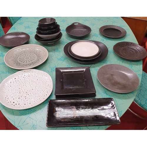 1545A - A Quantity of Ceramic Plates of Black Color Theme along with 3 Candle Holders .