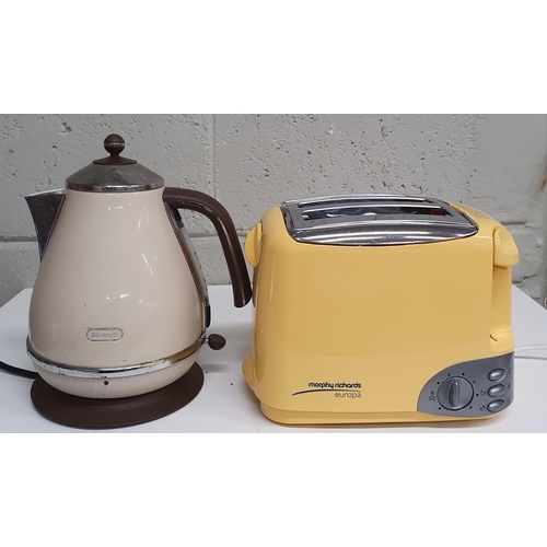 1547 - A Kenwood Coffee Machine along with a Delonghi Kettle and a Toaster .