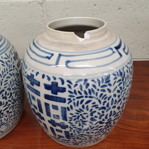 68 - A good pair of blue and white ground Oriental Ginger Pots. H 23 cm approx.