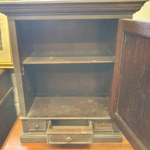 94 - A 19th Century, possibly earlier, Oak single door Wall Cabinet with triple drawer frieze. 41 x 22 x ... 