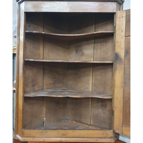 105 - A 19th Century Elm wall mounted Corner Unit with solid panelled door centre. W 75 x H 99 cm approx.