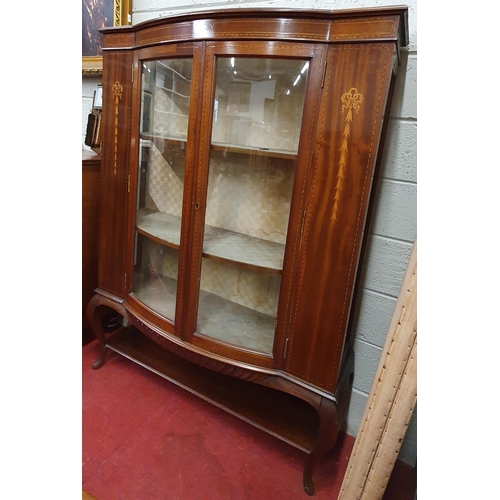 136 - Of good quality. An Edwardian Mahogany and Inlaid Display Cabinet with bow front outline on cabriole... 