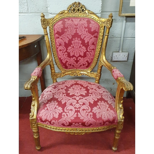 169 - A good pair of French Gilt Armchairs with upholstered backs, seats and arms on turned reeded support... 