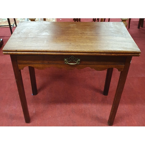 843 - A Georgian Mahogany foldover Tea Table with single frieze drawer. (leg hinge needs repair). w 77 x 7... 