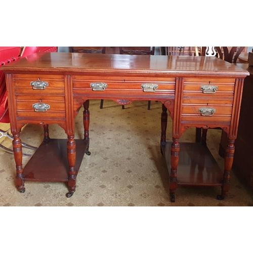 865 - A good late 19th early 20th Century Mahogany Kneehole Desk on turned supports and ceramic castors. 1... 