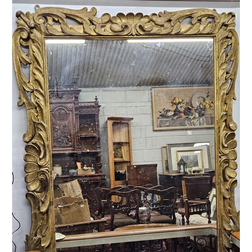 'The Lissadell Mirror'. An early to mid 19th Century Timber Gilt Overmantel Mirror with highly carved leaf decoration and plate mirror glass. Provenance - purchased for the vendor directly from the Gore-Booth family by the vendors agent. Circa 1840-60. 235 x 176 cm approx.