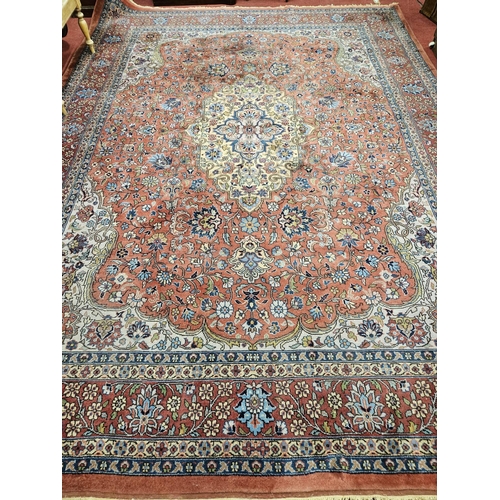 860 - A Terracotta ground Persian design Carpet, 100% wool with a traditional medallion design, 400 x 300 ... 