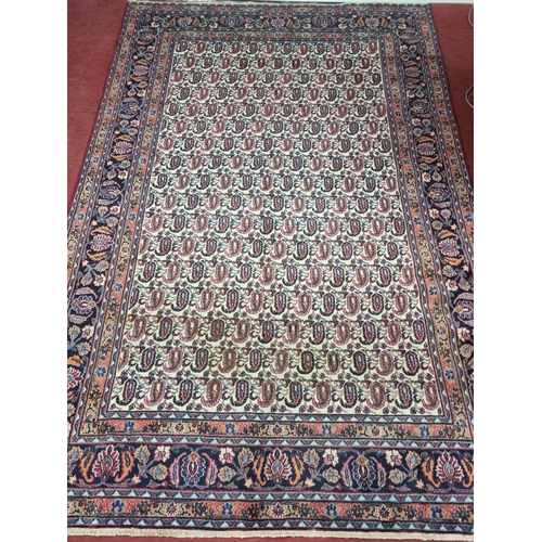 841 - A Cream ground Iranian Carpet with a unique all over Shahrukh Mia design, 310 x 206 cms approx.