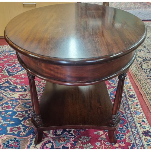 845 - A Mahogany oval coffee Table with pillared supports. H 48 x 60 x 60 cm approx.