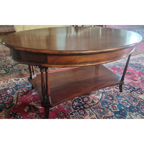 845 - A Mahogany oval coffee Table with pillared supports. H 48 x 60 x 60 cm approx.