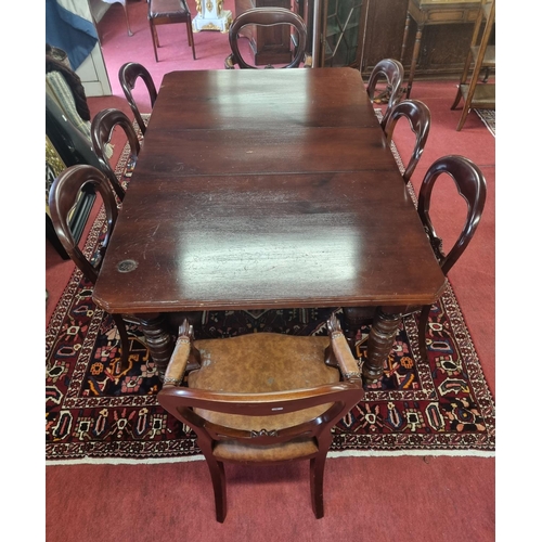 904 - A late 19th Century Mahogany single leaf Dining Table on turned supports along with a set of eight M... 