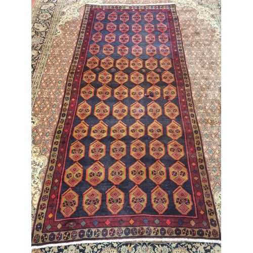 999 - A Baluch nomadic Runner with a unique all over medallion design, 290 x 135 cm approx.