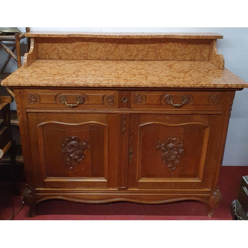 511 - A 19th Century Oak two door Washstand with marble top and swan neck handles. 119 x 55 x H 102 cm app... 