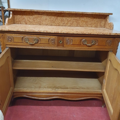 511 - A 19th Century Oak two door Washstand with marble top and swan neck handles. 119 x 55 x H 102 cm app... 