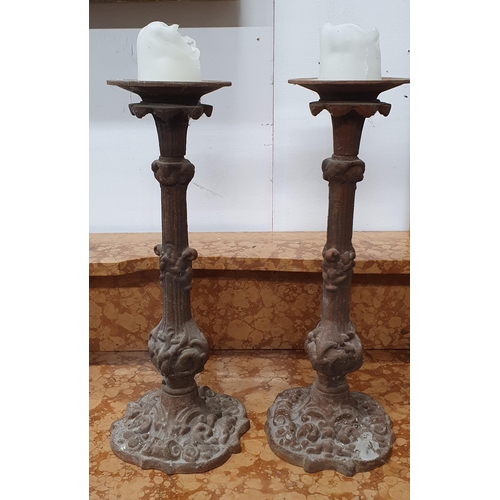 514 - A good pair of heavy cast Metal Pricket Stands. H 40 cm approx.