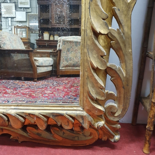 523 - 'The Lissadell Mirror'. An early to mid 19th Century Timber Gilt Overmantel Mirror with highly carve... 