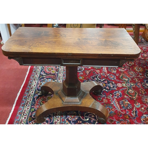 538 - A 19th Century Rosewood and Veneered foldover Card Table with baized interior on octagonal supports ... 