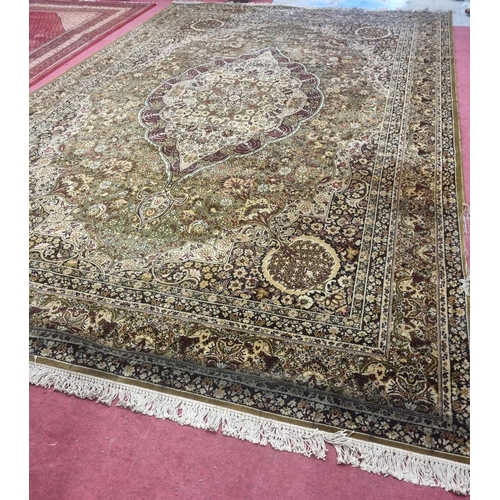 1002 - A large green and cream ground Carpet with multi borders and unique medallion design. 488 x 300 cm a... 