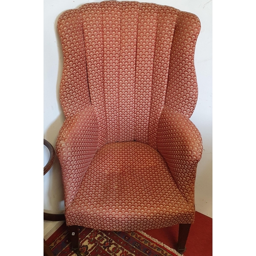 1005 - A good early to mid 19th Century Wingback Armchair on square tapered supports and brass castors. W 6... 