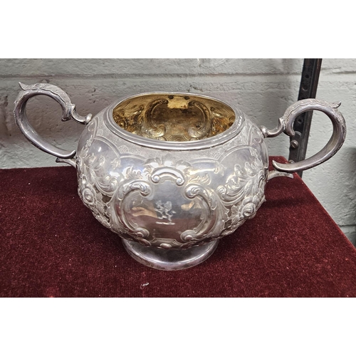 379 - An Irish Silver three piece Tea set, John Smith 1864, with a highly embossed outline, 1425 gms