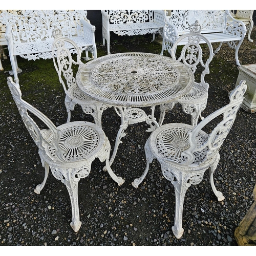 1033 - A white Metal patio Table and Chairs with pierced outline. Table H 69 x D 79 cm approx.