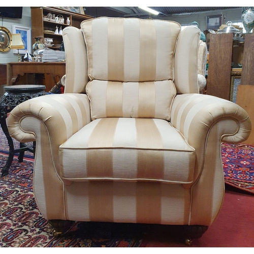 842 - A good Finline Furniture wingback Armchair with gold coloured upholstery in pristine condition.
H 10... 