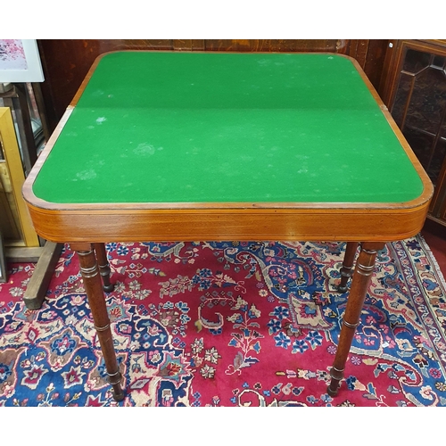 873 - A really good Regency Mahogany and Inlaid Foldover Card Table with satinwood banded top on turned su... 