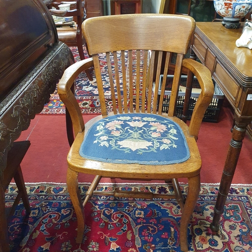 880 - A late 19th Century Oak Bankers Chair with tapestry upholstered seat and cabriole supports.
H 87 x 5... 