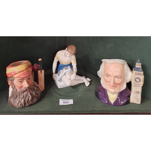 899 - Three Royal Doulton Figures to include two Toby Jugs. 'WD Grace' and 'John Dalton' along with a figu... 