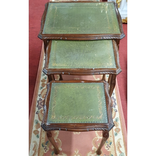 1073 - A 20th Century Nest of three Side Tables  with leather inserts and glass tops. Tallest being 53 x 42... 