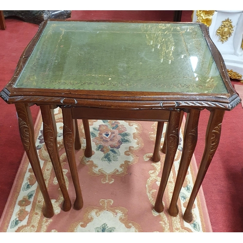 1073 - A 20th Century Nest of three Side Tables  with leather inserts and glass tops. Tallest being 53 x 42... 