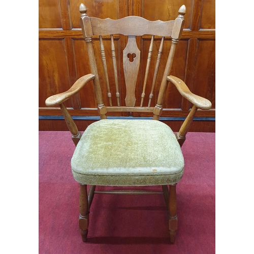 1076 - A 20th Century Oak Armchair with spindle back.
W 63 x SH 46 x BH 100 cm approx.