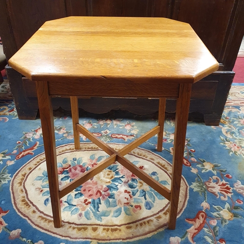 1078 - An  Aesthetic Movement 20th Century Centre Table with canted corners, square tapered supports and st... 