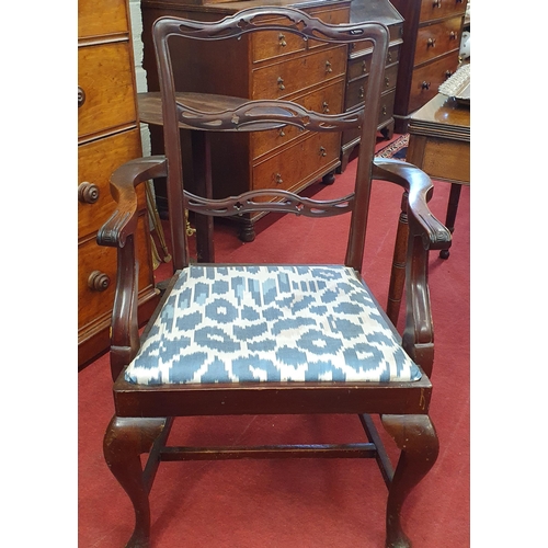 1079 - A late 19th Century Ladderback Carver with pierced outline and cabriole front supports. W 61 x SH 44... 