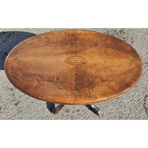 1084 - A 19th Century Walnut and veneered tilt top oval supper Table with original pins and catch.
H 72 x L... 