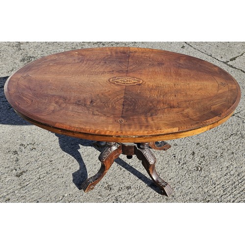 1084 - A 19th Century Walnut and veneered tilt top oval supper Table with original pins and catch.
H 72 x L... 