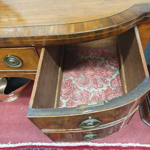 63 - A good early 19th Century Mahogany Bowfronted Sideboard on square tapered supports and ebony inlaid ... 