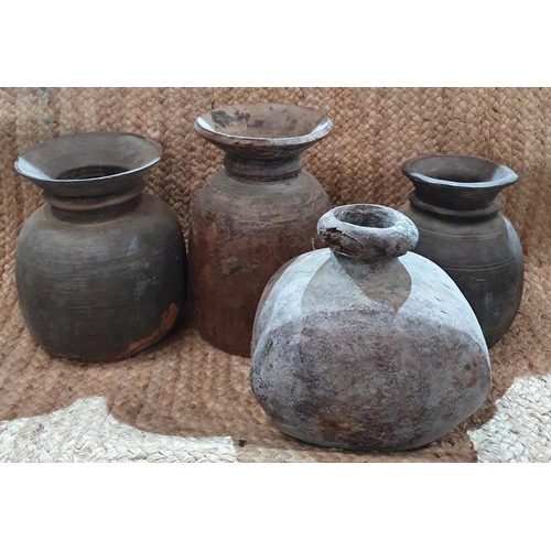 A group of 4 wooden pots.