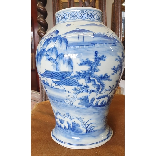 86 - A good pair of blue and white ground Ginger Pots, lacking lids. H 27 cm approx.