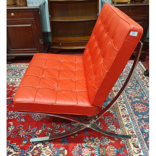 223 - A good Barcelona style Chair with Chrome detail and deep buttoned red cushions. W 75 x SH 41 x BH 83... 