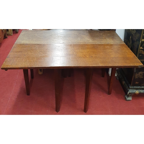 276 - An early 19th, possibly 18th, Century Oak Dropleaf Table with square tapered supports. 115 x 117 x H... 