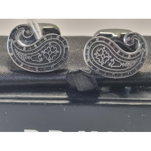 307 - A pair of designer Cufflinks.