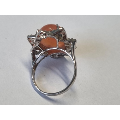 324 - A Silver and gem set cluster Ring, size O.