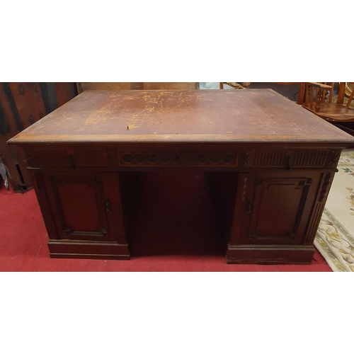 423 - Of Superb quality. A 19th Century Walnut Pedestal Desk with highly inlaid front and back with emboss... 