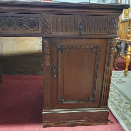 423 - Of Superb quality. A 19th Century Walnut Pedestal Desk with highly inlaid front and back with emboss... 