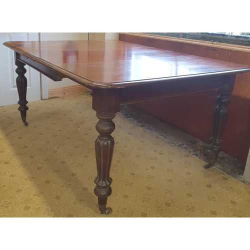 610 - A lovely early 19th Century Mahogany single leaf Dining Table on turned reeded and fluted supports a... 